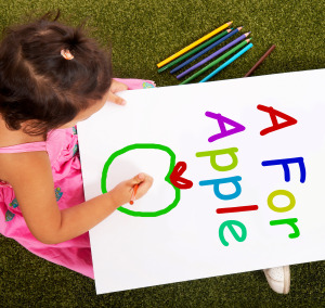 Girl Writing Apple Shows Kid Learning The Alphabet
